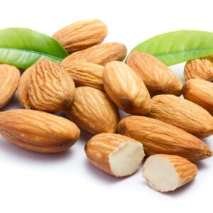 Almonds with leaves isolated on white background