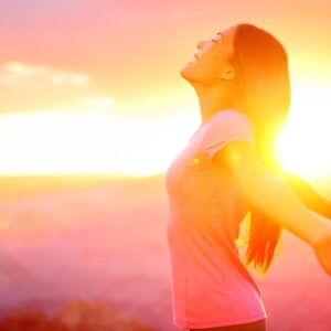 Free happy woman enjoying nature sunset